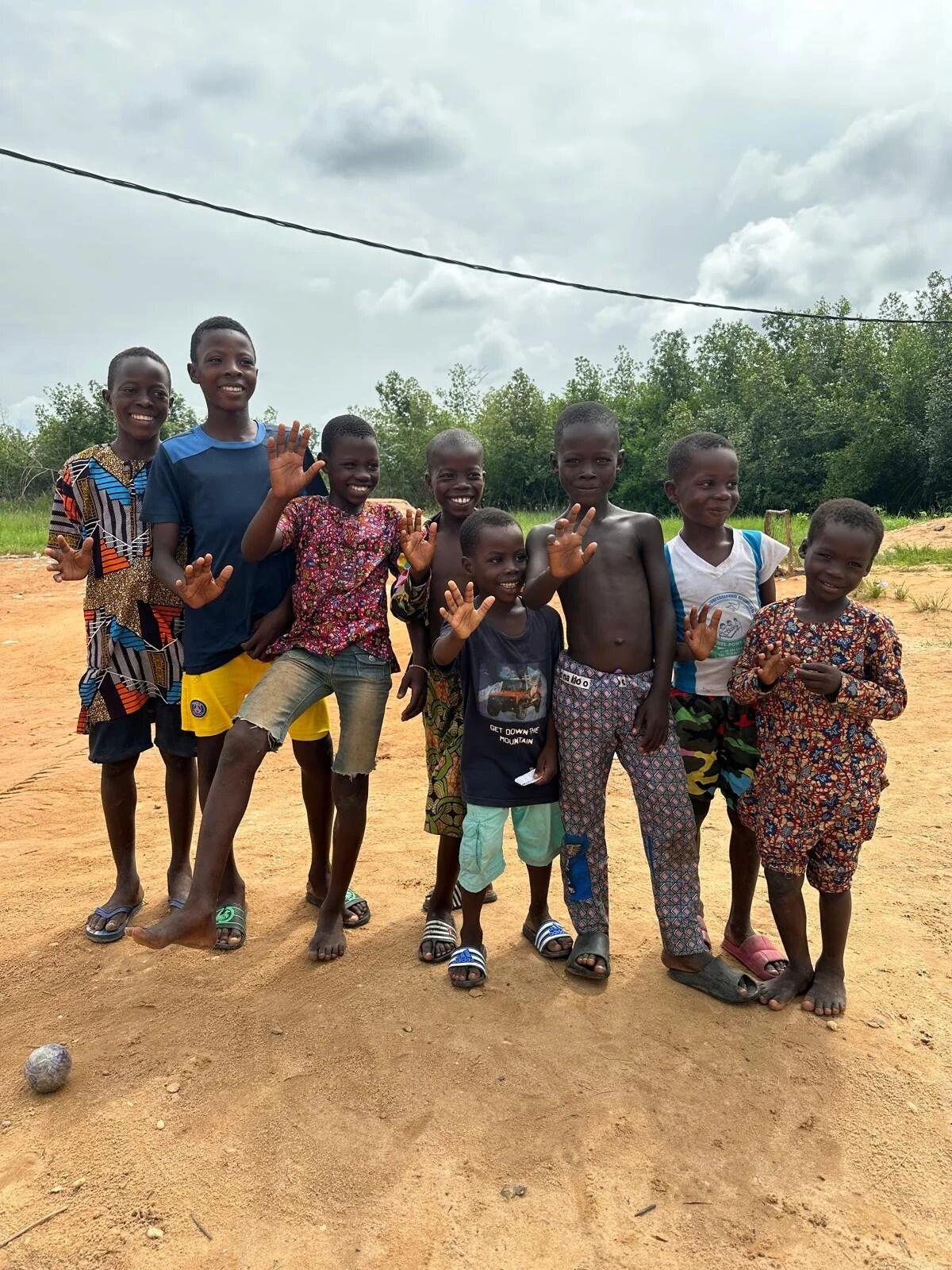 Children smiling on the shore of the Keta Lagoon