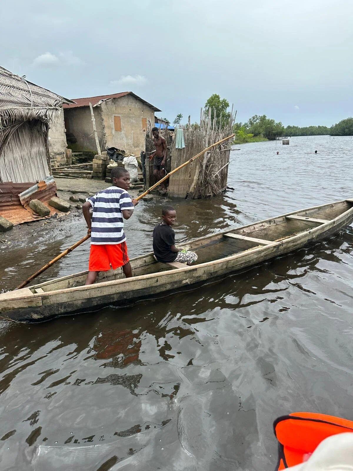 Canoes moored alongside homes on the Keta Lagoon